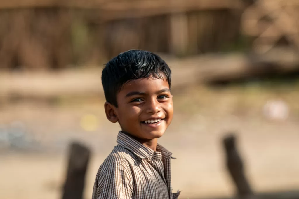 boy in black and white striped shirt