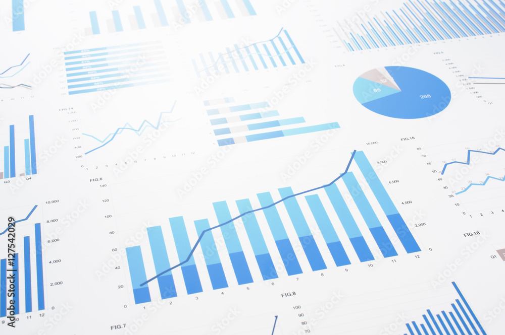 Many charts and graphs. Reflection light and flare. Concept image of data gathering and statistical working.